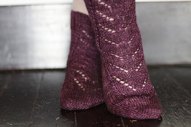 Burgundy socks with lace instep.