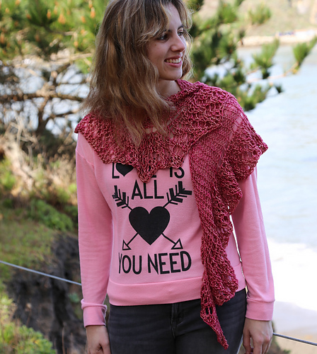Small triangle shaped shawl with a wide lace flounce edging. Knit all as one piece.