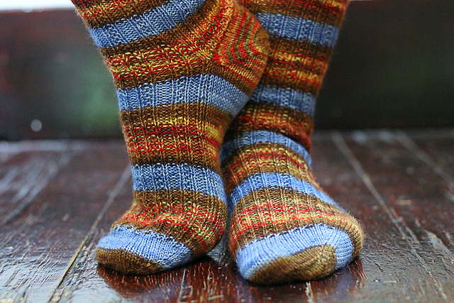 Brown, red, and sky blue striped ribbed socks