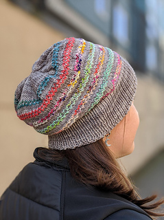 A tonal grey beanie with colourful stripes