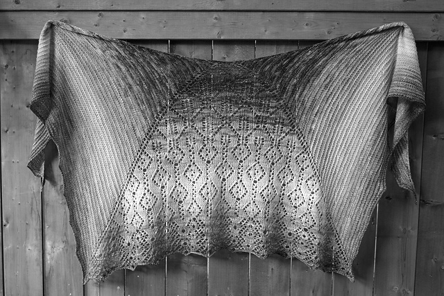 Black and white photo of a lace shawl